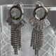 Dazzling cascading crystal studded silver toned earrings