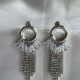 Dazzling cascading crystal studded silver toned earrings