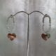 Silver toned heart dangle crystals studded earrings