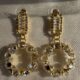 Gold toned sparkling crystal studded loop earrings