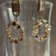 Gold toned sparkling crystal studded loop earrings