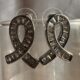 Silver toned ribbon-shaped earrings