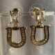 Gold toned crystal studded drop earrings