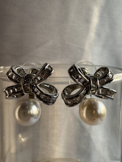 Silver toned bow shape earrings