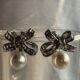 Silver toned bow shape earrings