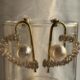 Silver toned crystals and pearl studded heart shape earrings