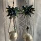Beautiful pearl drop with blue-green beaded cluster settings at top in silver-tone chain earrings
