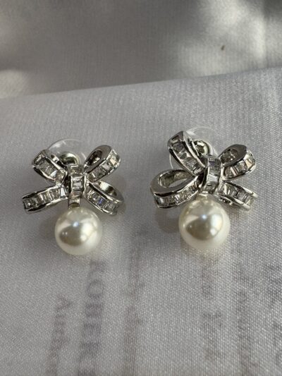 Silver toned bow shape earrings