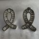 Silver toned ribbon-shaped earrings