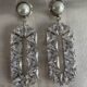 Dangling geometric crystal studded silver toned earrings