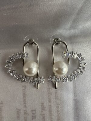 Silver toned crystals and pearl studded heart shape earrings