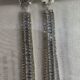 Stone studded glamorous long drop dazzling silver toned earrings