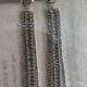 Stone studded glamorous long drop dazzling silver toned earrings