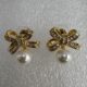 Exquisite golden bow shaped earrings