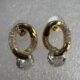 Gold toned crystals studded loop earring