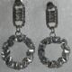 Sparkling circle silver toned stone studded drop earrings
