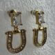 Gold toned crystal studded drop earrings