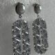 Dangling geometric crystal studded silver toned earrings