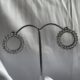 Circular crystal studded silver toned earrings