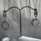 Sparkling circle silver toned stone studded drop earrings