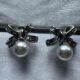 Silver toned bow shape earrings