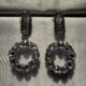 Sparkling circle silver toned stone studded drop earrings