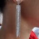 Stone studded glamorous long drop dazzling silver toned earrings