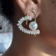 Silver toned crystals and pearl studded heart shape earrings