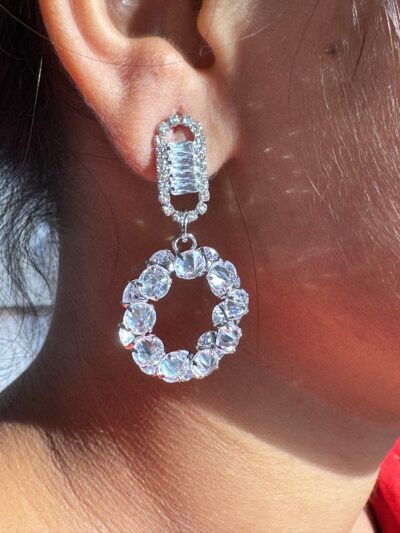 Sparkling circle silver toned stone studded drop earrings