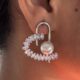 Silver toned crystals and pearl studded heart shape earrings