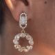 Gold toned sparkling crystal studded loop earrings