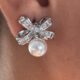 Silver toned bow shape earrings