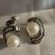Silver-tone shimmering crystal studded curve with pearl beauty
