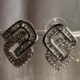 Crystal embellished geometric modern design silver tone stud earrings
