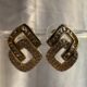 Crystal-encrusted geometric statement earrings, gold-plated, modern design
