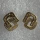 Crystal-encrusted geometric statement earrings, gold-plated, modern design