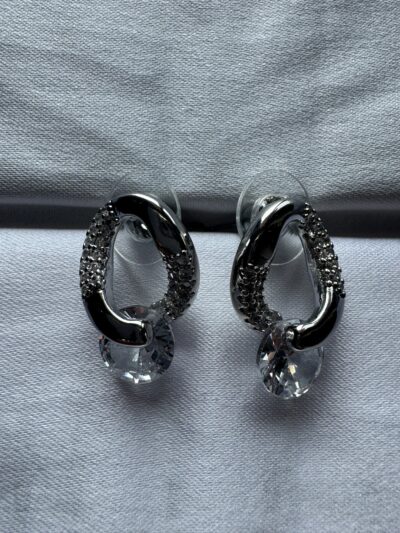 IMG_3007 Elegant crystal drop silver tone oval design with studded crystals earrings