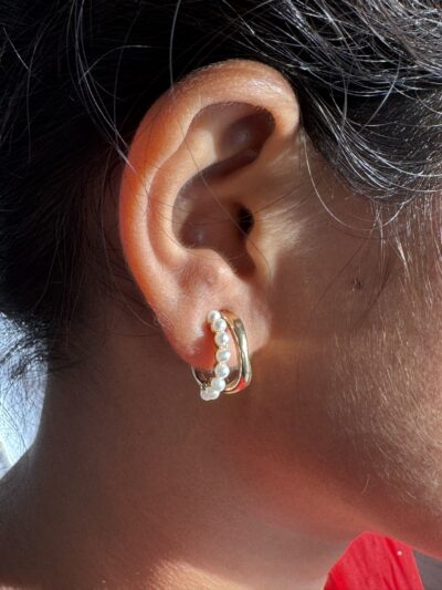 IMG_3173 Gold-tone pearl hoops blend modern curves