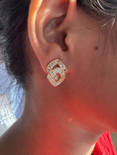 Crystal-encrusted geometric statement earrings, gold-plated, modern design