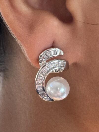 Silver-tone shimmering crystal studded curve with pearl beauty