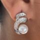 Silver-tone shimmering crystal studded curve with pearl beauty