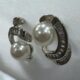 Silver-tone shimmering crystal studded curve with pearl beauty