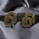 Crystal-encrusted geometric statement earrings, gold-plated, modern design