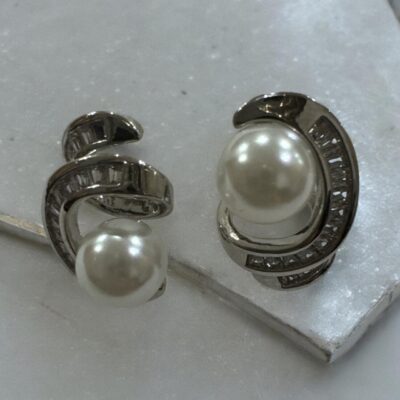 Silver-tone shimmering crystal studded curve with pearl beauty